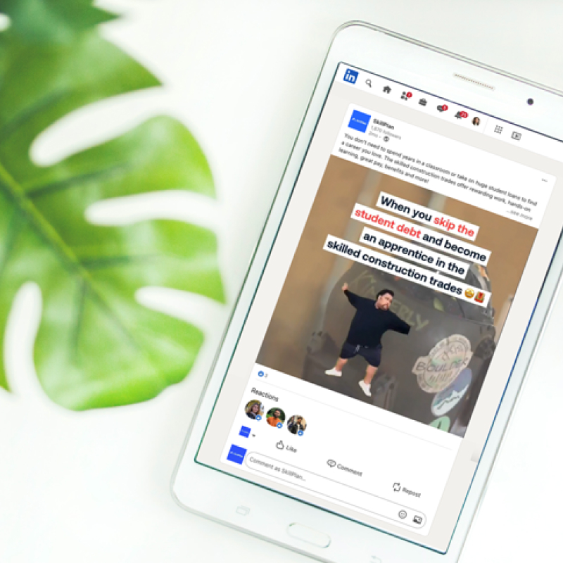 Smartphone on a white surface showing a social media post.